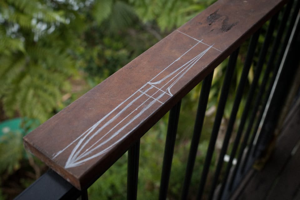 The Dagger shape marked out on hardwood decking offcut.