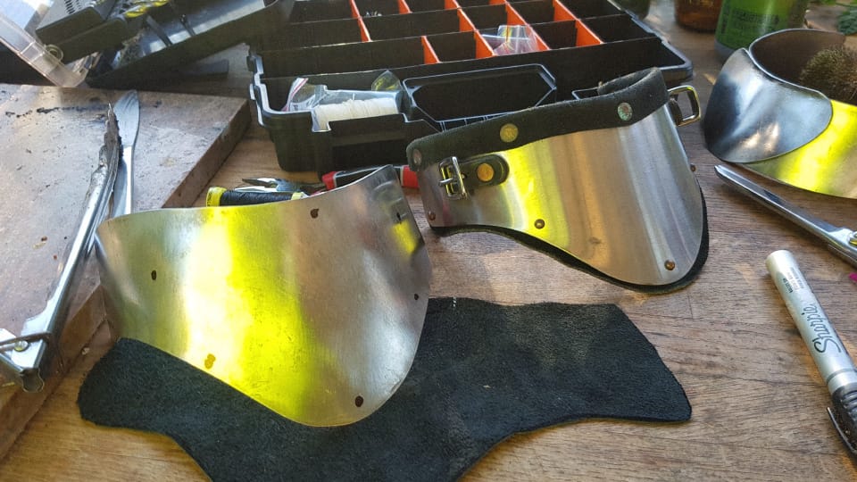 My cut stainless piece compared to the original WTC gorget