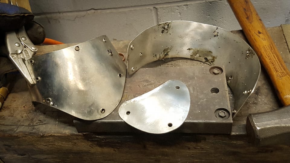 Stainless gorget pieces drilled