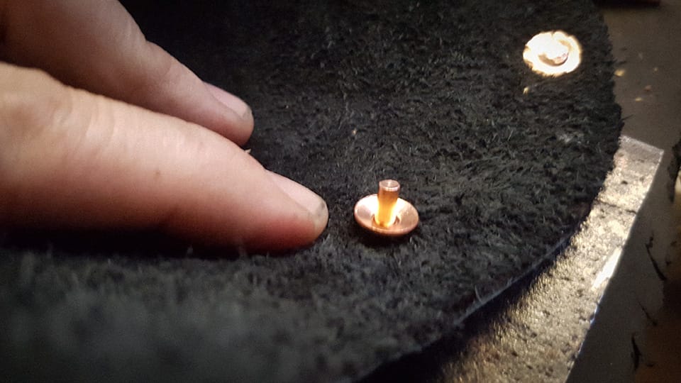 Adding the rivets — cut to size and peened.