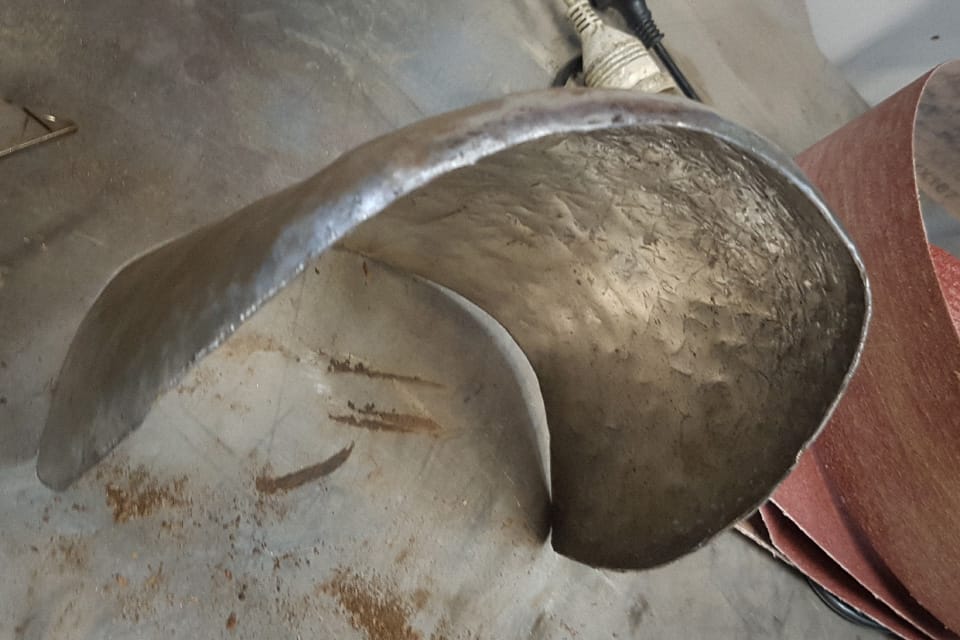 The single pauldron beat from a flat piece of mild steel sheet