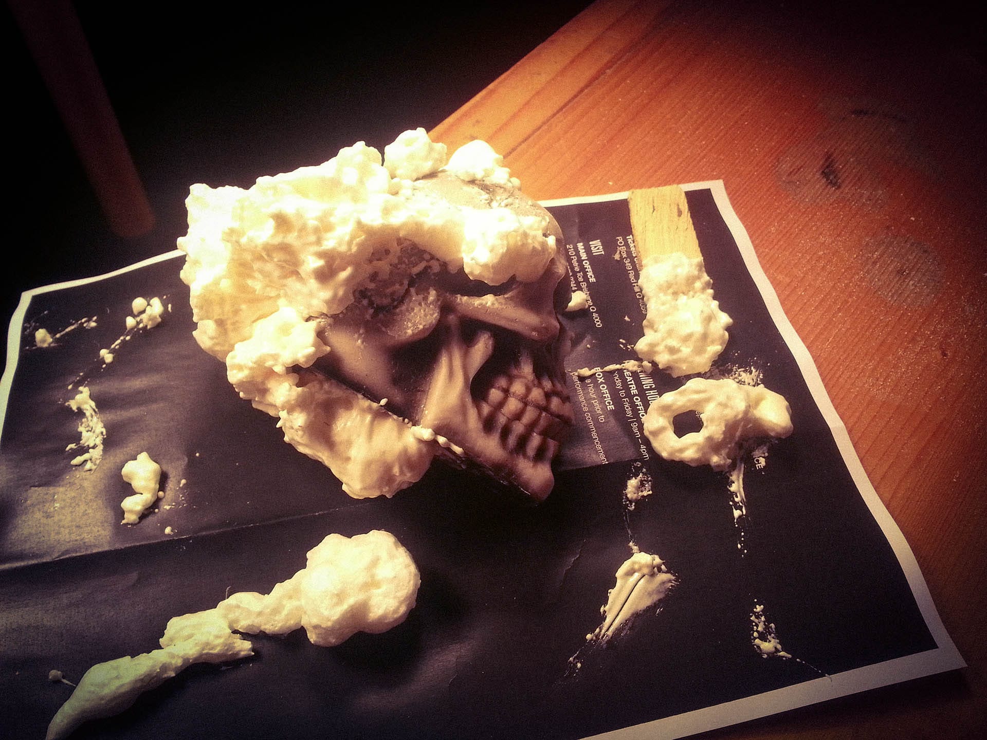 A shattered prop skull sits covered in far too much expanding foam