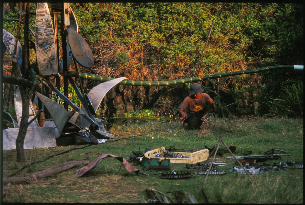 A man assembles art sculpture at Boredoms - Boadrum111 - Byron Bay November 2011