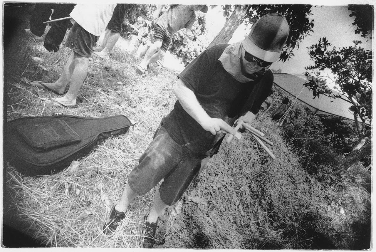 Tones McCall sands down burrs on drum sticks at the Island Quarry - Boredoms - Boadrum111 - Byron Bay November 2011